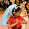 Young girl in red kimono at diversity event